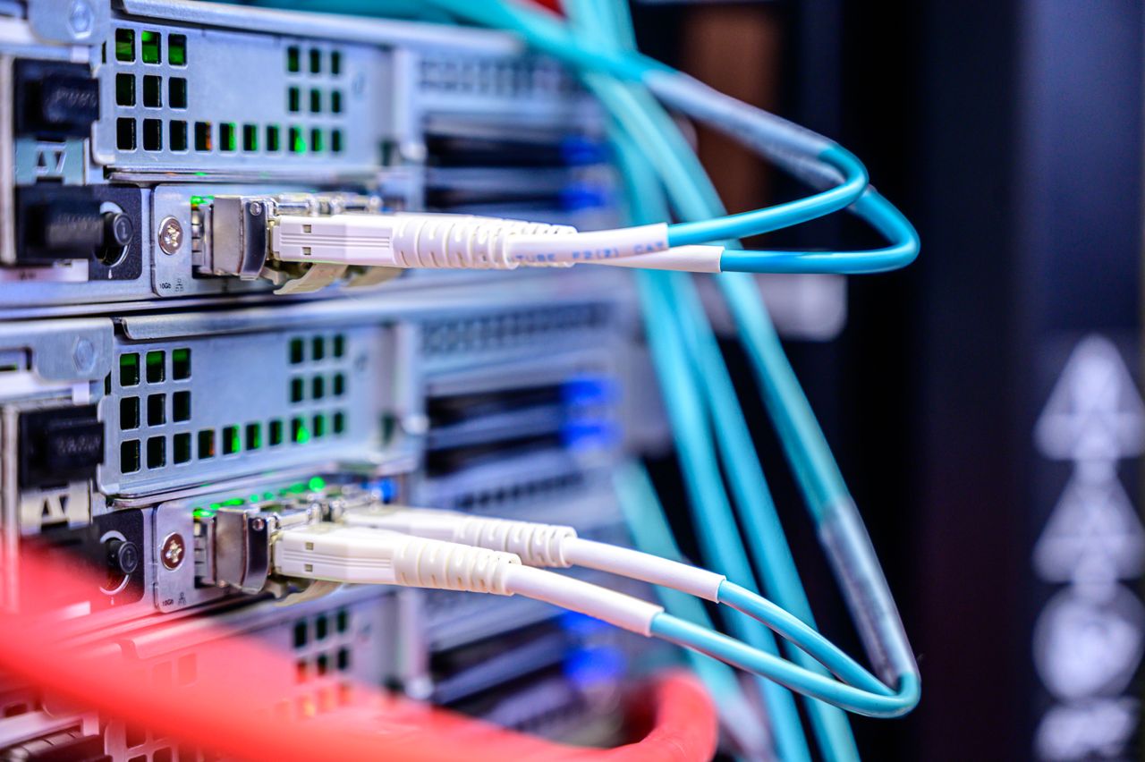 about-03 Detailed shot of Ethernet cables connected to server ports highlighting technology infrastructure.